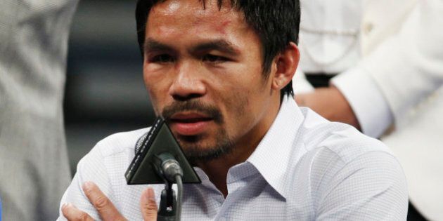 FILE - In this May 2, 2015 photo, Manny Pacquiao answers questions during a press conference following his welterweight title fight against Floyd Mayweather Jr. in Las Vegas. Pacquiao could face disciplinary action from Nevada boxing officials for failing to disclose a shoulder injury before the fight. Nevada Athletic Commission Chairman Francisco Aguilar said that the state attorney generalâs office will look at why Pacquiao checked ânoâ a day before the fight on a commission questionnaire asking if he had a shoulder injury. (AP Photo/John Locher)