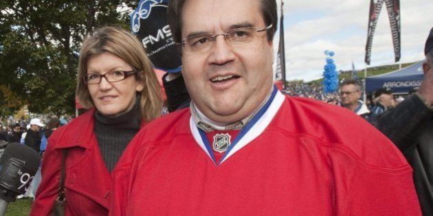 MP Denis Coderre, right, dressed in a Montreal Canadiens jersey, arrives on the on the Plains of Abraham for