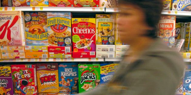 UNITED STATES - SEPTEMBER 21: A shopper pushes her cart down the cereal aisle, including General Mills cereal Fruity Cheerios, in a New York supermarket Thursday, September 21, 2006. General Mills Inc., the second-largest U.S. cereal maker, said first-quarter profit rose 6 percent, exceeding analysts' estimates on higher sales of new cereals, including Fruity Cheerios, and Yoplait yogurt . (Photo by Stephanie Kuykendal/Bloomberg via Getty Images)