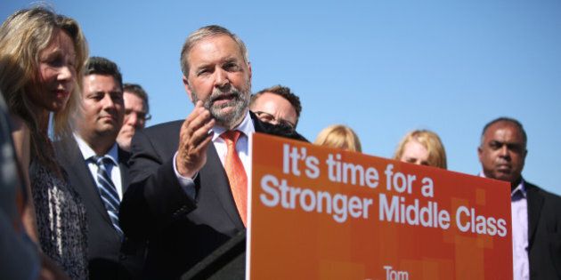 TORONTO, ON - JULY 20: With a backdrop of NDP MP's, NDP Leader Thomas Mulcair speaks during an Ontario tour launch at the Hugh Garner Co-op. (Cole Burston/Toronto Star via Getty Images)