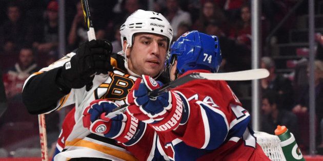 MONTREAL, QC - OCTOBER 16: Alexei Emelin #74 of the Montreal Canadiens fights with Milan Lucic #17 of the Boston Bruins in the NHL game at the Bell Centre on October 16, 2014 in Montreal, Quebec, Canada. (Photo by Francois Lacasse/NHLI via Getty Images)