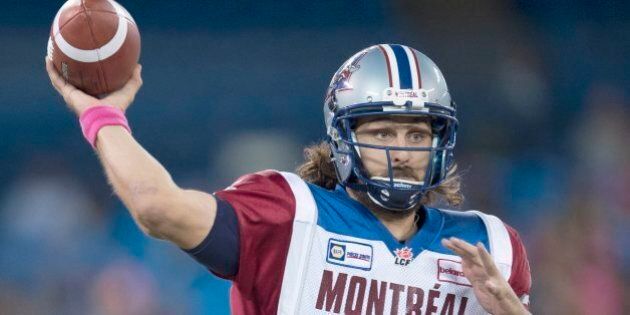 Montreal Alouettes quarterback Jonathan Crompton launches a pass against the Toronto Argonauts during the first half CFL game in Toronto on Saturday, Oct. 18, 2014. (AP Photo/The Canadian Press, Frank Gunn)