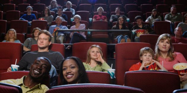 People in Theater Watching Movie