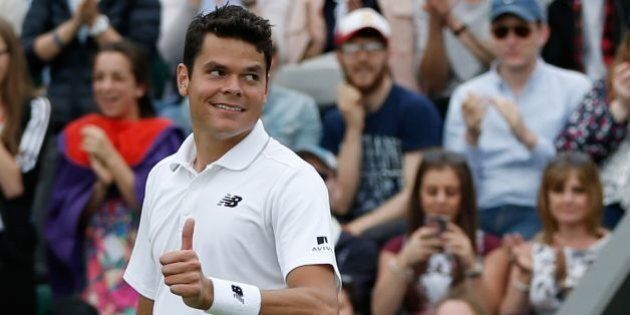 Canada's Milos Raonic celebrates beating Italy's Andreas Seppi during their men's singles second round match on the fourth day of the 2016 Wimbledon Championships at The All England Lawn Tennis Club in Wimbledon, southwest London, on June 30, 2016. / AFP / ADRIAN DENNIS / RESTRICTED TO EDITORIAL USE (Photo credit should read ADRIAN DENNIS/AFP/Getty Images)