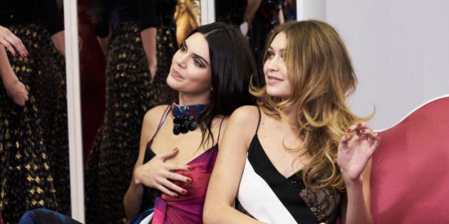 Kendall Jenner and Gigi Hadid pose wearing Diane Von Furstenberg Fall 2016 during New York Fashion Week on February 14, 2016 in New York City.