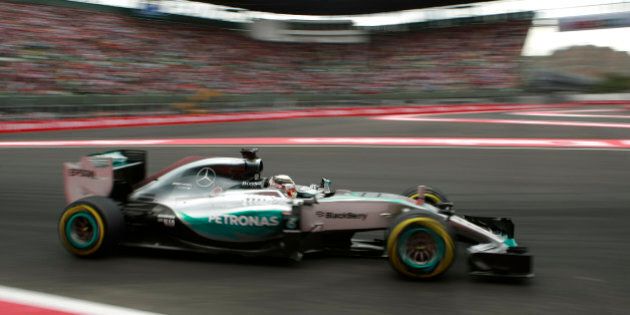 Mercedes driver Lewis Hamilton of Britain steers his car during qualifying for the Formula One Mexico Grand Prix auto race in Mexico City, Saturday, Oct. 31, 2015. Mercedes driver Nico Rosberg of Germany will start Sundayâs Formula One Mexico Grand Prix, the countryâs first race since 1992, from pole position, after beating Mercedes team mate Lewis Hamilton by two-tenths of a second in qualifying. Ferrariâs Sebastian Vettel took the third place. (AP Photo/Christian Palma)