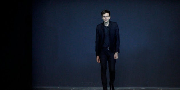 French designer Hedi Slimane appears at the end of his Spring/Summer 2013 women's ready-to-wear fashion show for French fashion house Saint Laurent Paris during Paris fashion week October 1, 2012. REUTERS/Gonzalo Fuentes (FRANCE - Tags: FASHION)