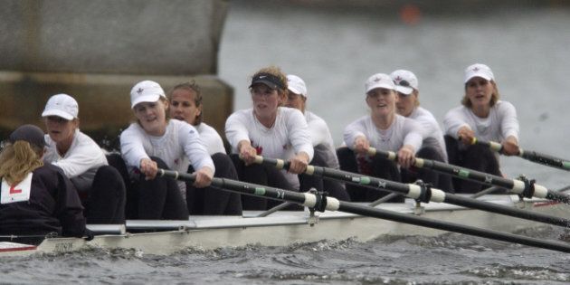 The Canadian women's national team, the London Training Center, passes underneath the Elliot Bridge in Cambridge, Mass., Sunday, Oct. 19, 2003, en route to winning the Head of the Charles Regatta championship eights. The team finished the race in 15 minutes, 31 seconds, 13 seconds faster than the previous mark, set in 1997 by Rowing Canada Aviron. (AP Photo/Stanley Hu)