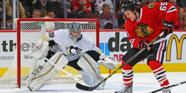 Jan 6, 2016; Chicago, IL, USA; Chicago Blackhawks center Andrew Shaw (65) with the puck in front of Pittsburgh Penguins goalie Marc-Andre Fleury (29) during the first period at the United Center. Mandatory Credit: Dennis Wierzbicki-USA TODAY Sports