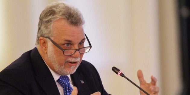 Premier Philippe Couillard of Quebec speaks at the New England Governors and eastern Canadian Premiers 38th annual conference Monday, July 14, 2014, in Bretton Woods, N.H. Energy and economic collaboration were the main topics at Sunday and Monday's conference. Eastern Canada is rich in hydropower while New England markets are eager to shore up supply and control some of the nation's highest energy costs. (AP Photo/Jim Cole)