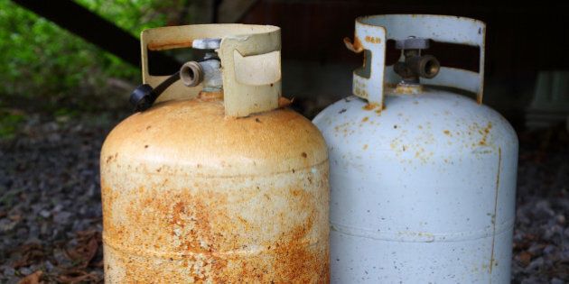 Two old rusty dangerous gas/propane bottles.