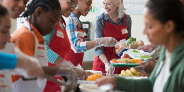 Volunteers serving food at community kitchen