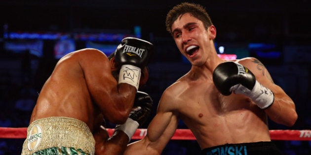 DALLAS, TX - JUNE 15: (R-L) Mikael Zewski connects with a right to the body of Damian Friasi in the seventh round of their welterweight bout at the American Airlines Center on June 15, 2013 in Dallas, Texas. Zewski won the bout by a unanimous decision over Friasi. (Photo by Tom Pennington/Getty Images)
