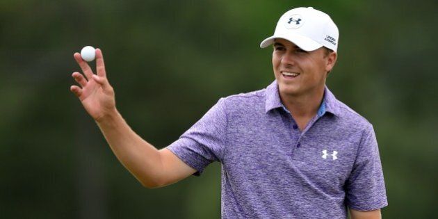 Jordan Spieth of the US waves to patrons at the 18th hole during Round 2 of the 79th Masters Golf Tournament at Augusta National Golf Club on April 10, 2015, in Augusta, Georgia. AFP PHOTO/JIM WATSON (Photo credit should read JIM WATSON/AFP/Getty Images)