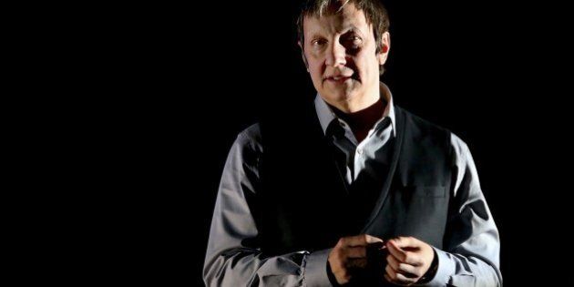 Quebec director Robert Lepage is seen on stage on March 8, 2015 at the Comet Chalons-en-Champagne during his latest creation '887' in which the memories of childhood, nostalgia and Quebec are evoked. The preview of play was performed on March 9 and 10 in Chalons-en-Champagne and will play in Toronto, Canada on July 14, 2015 before a world tour. AFP PHOTO / FRANCOIS NASCIMBENI (Photo credit should read FRANCOIS NASCIMBENI/AFP/Getty Images)