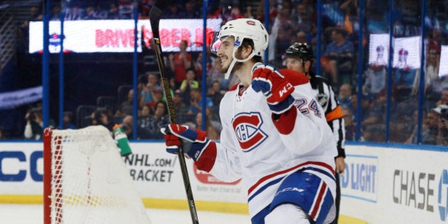 Mar 31, 2016; Tampa, FL, USA; Montreal Canadiens left wing Phillip Danault (24) celebrates after scoring on an empty net goal during the third period against the Tampa Bay Lightning at Amalie Arena. The Canadiens won 3-0. Mandatory Credit: Kim Klement-USA TODAY Sports