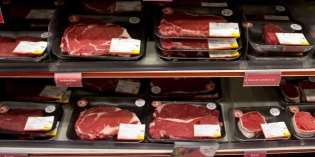 A sign reading 'French beef meat' is seen in front of meat products in a supermarket during a visit of the French minister of agriculture as part of the 'Viandes de France' (French meat) national day on August 25, 2015 in Paris. AFP PHOTO / KENZO TRIBOUILLARD (Photo credit should read KENZO TRIBOUILLARD/AFP/Getty Images)