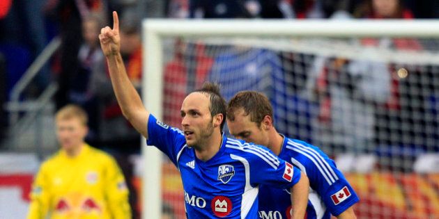 Montreal Impact's Justin Mapp (21) celebrates his goal during the first half of an MLS soccer game against the New York Red Bulls in Harrison, N.J., Saturday, March 31, 2012. (AP Photo/Mel Evans)