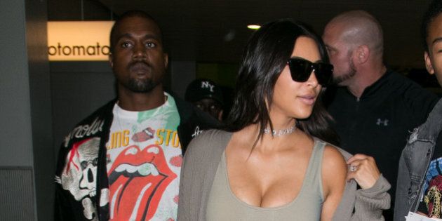 PARIS, FRANCE - JUNE 13: Kanye West and wife Kim Kardashian West arrive at Chrle-de-Gaulle airport on June 13, 2016 in Paris, France. (Photo by Marc Piasecki/GC Images)