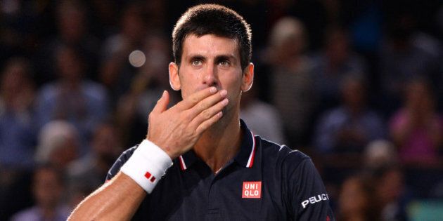 PARIS, FRANCE - NOVEMBER 02: Novak Djokovic of Serbia celebrates after victory against Milos Raonic of Canada in their Final match during day 7 of the BNP Paribas Masters held at the at Palais Omnisports de Bercy in Paris, France, on November 2, 2014. After Djokovic won the BNP Paribas Masters trophy, he celebrated his 600th victory of his career. (Photo by Mustafa Yalcin/Anadolu Agency/Getty Images)