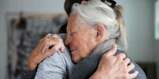 senior mother and daughter hugging