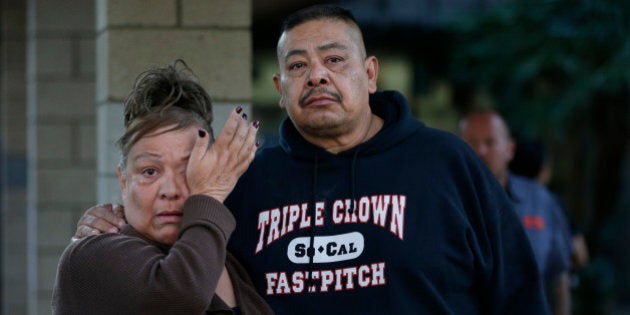 People wait at a community center for a family member who was near a shooting that killed multiple people at a social services center, Wednesday, Dec. 2, 2015, in San Bernardino, Calif. (AP Photo/Jae C. Hong)