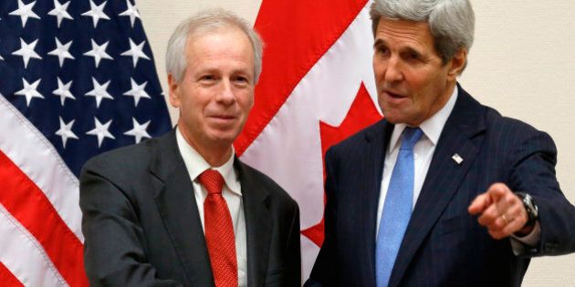 Canadian Foreign Minister Stephane Dion, left, meets with U.S. Secretary of State John Kerry alongside NATO ministerial meetings at NATO Headquarters in Brussels, Tuesday, Dec. 1, 2015. (Jonathan Ernst/Pool Photo via AP)