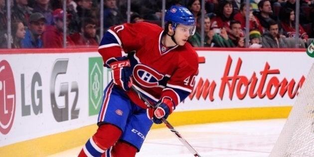 MONTREAL, QC - FEBRUARY 2: Nathan Beaulieu #40 of the Montreal Canadiens skates with the puck during the NHL game against the Winnipeg Jets at the Bell Centre on February 2, 2014 in Montreal, Quebec, Canada. The Jets defeated the Canadiens 2-1. (Photo by Richard Wolowicz/Getty Images)