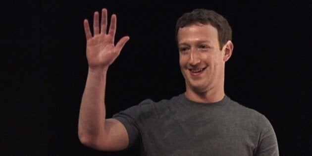 Facebook's creator US Mark Zuckerberg waves before speaking on the opening day of the 2015 Mobile World Congress (MWC) in Barcelona on March 2, 2015. Phone makers will seek to seduce new buyers with even smarter Internet-connected watches and other wireless gadgets as they wrestle for dominance at the world's biggest mobile fair starting today. AFP PHOTO / LLUIS GENE (Photo credit should read LLUIS GENE/AFP/Getty Images)