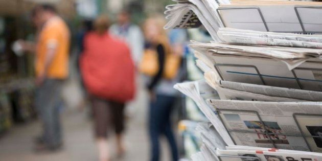 Newspaper rack on street