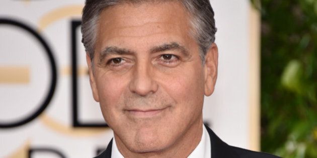 George Clooney wears a buttong reading