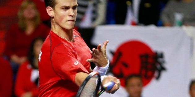 VANCOUVER, CANADA - MARCH 8: Vasek Pospisil of Canada returns a shot against Go Soeda of Japan during their Davis Cup match March 8, 2015 in Vancouver, British Columbia, Canada. (Photo by Jeff Vinnick/Getty Images)