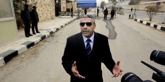 Canadian Al-Jazeera English journalist Mohamed Fahmy, speaks to the media outside a court before his retrial in Cairo, Egypt, Monday, Feb. 23, 2015. The retrial of two Al-Jazeera English journalists who face terror-related charges in a case widely criticized by human rights organizations and media groups has been postponed to March 8. (AP Photo/Amr Nabil)