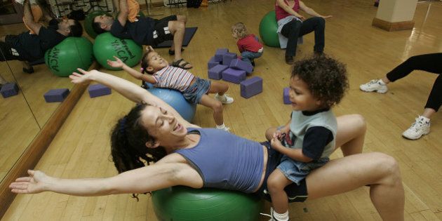 Maegan (cq) Robins with her son, Selah, 2, leads a parent/child exercise class at the Hollywood YMCA, allowing moms (and dads) to exercise with their babies/toddlers Â actually getting their heart rate up, as opposed to classes that simply offer yoga stretches are other mild forms of exercise, Monday, March 7, 3005. (Photo by Robert Gauthier/Los Angeles Times via Getty Images)