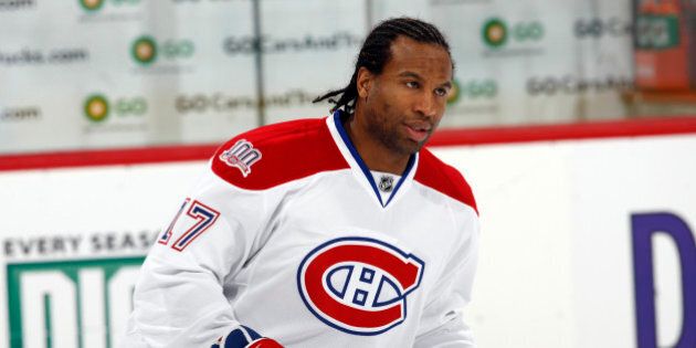 Montreal Canadiens right winger George Laraque warms up before facing the Colorado Avalanche in the first period of an NHL hockey game in Denver on Friday, Feb. 13, 2009. (AP Photo/David Zalubowski)