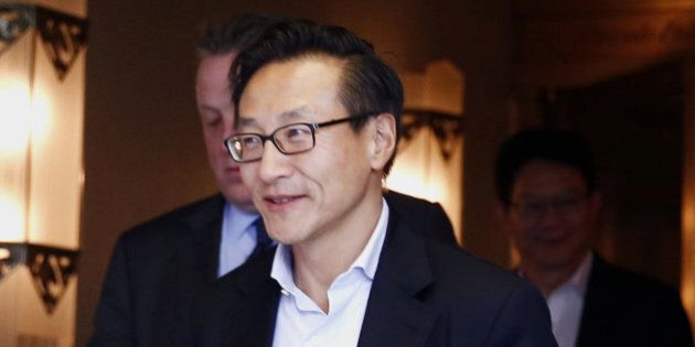 Joseph 'Joe' Tsai, vice chairman and co-founder of Alibaba Group Holding Ltd., exits after a meeting at the Waldorf Astoria in New York, U.S., on Monday, Sept. 8, 2014. Alibaba Group Holding Ltd., the e-commerce company whose fortunes surged along with Chinas economy, plans a historic U.S. initial public offering that may also claim the global record. Photographer: Jin Lee/Bloomberg via Getty Images