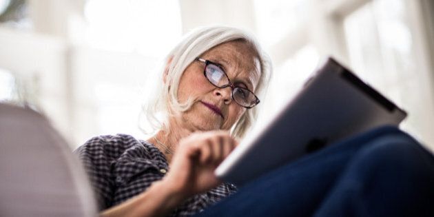 senior woman using tablet