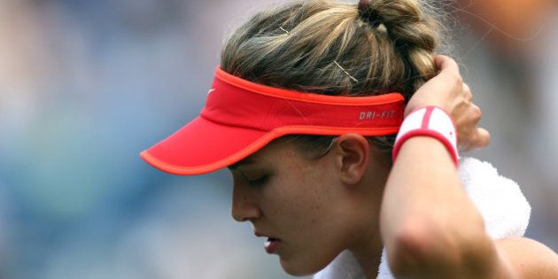 NEW YORK, NY - SEPTEMBER 04: Eugenie Bouchard reacts against Dominika Cibulkova of Slovakia during their Women's Singles Third Round match on Day Five of the 2015 US Open at the USTA Billie Jean King National Tennis Center on September 4, 2015 in the Flushing neighborhood of the Queens borough of New York City. (Photo by Clive Brunskill/Getty Images)