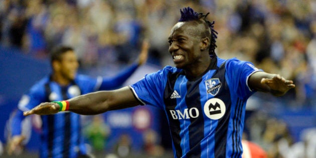 Mar 12, 2016; Montreal, Quebec, CAN; Montreal Impact forward Dominic Oduro (7) celebrates after scoring a goal against the New York Red Bulls during the second half at the Olympic Stadium. Mandatory Credit: Eric Bolte-USA TODAY Sports