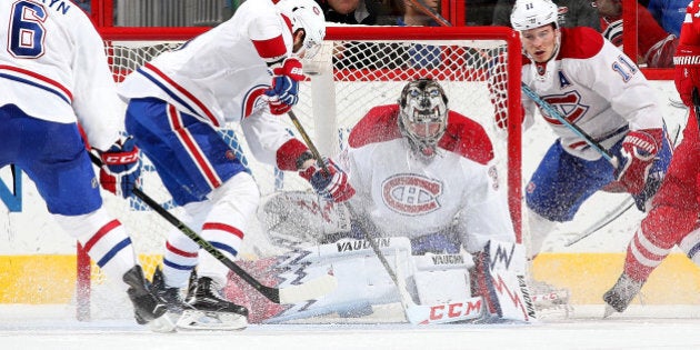 RALEIGH, NC - APRIL 07: Charlie Lindgren #35 of the Montreal Canadiens goes down in the crease to protect the net during an NHL game against the Carolina Hurricanes at PNC Arena on April 7, 2016 in Raleigh, North Carolina. (Photo by Gregg Forwerck/NHLI via Getty Images)