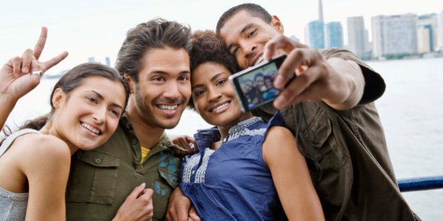 Friends taking self portrait in Toronto, Canada