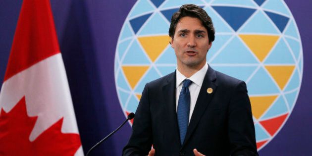 Canadian Prime Minister Justin Trudeau gestures during a news conference following the Asia-Pacific Economic Cooperation Summit of Leaders Thursday, Nov. 19, 2015 in Manila, Philippines. Prime Minister Trudeau is embarking on his first foreign trip since becoming a Prime Minister.(AP Photo/Bullit Marquez)