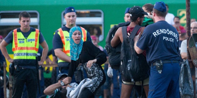 BUDAPEST, HUNGARY - SEPTEMBER 03: Migrants protest against being taken to a refugee camp from a train that has been held at Bicske station on September 3, 2015 in Bicske, near Budapest, Hungary. Although the station has reopened, all international trains to Western Europe have been cancelled. According to the Hungarian authorities a record number of migrants from many parts of the Middle East, Africa and Asia are crossing the border from Serbia. Since the beginning of 2015, the number of migrants using the so-called Balkans route has exploded with arrivals in Greece from Turkey, and then travelling on through Macedonia and Serbia before entering the EU via Hungary. The massive increase, said to be the largest migration of people since World War II, led Hungarian Prime Minister Victor Orban to order Hungary's army to build a steel and barbed wire security barrier along its entire border with Serbia, after more than 100,000 asylum seekers from a variety of countries and war zones entered the country so far this year. (Photo by Matt Cardy/Getty Images)