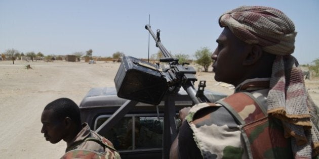 Nigerien soldiers patrol along the Nigerian border, near the south-eastern city of Bosso, on May 25, 2015. Niger has extended for three months the state of emergency in its southeastern Diffa region where the army has been battling Boko Haram militants since February, authorities announced on May 27, 2015. The operation, nicknamed Barkhane, which succedeed to Serval one, is taking place across Mauritania, Mali, Burkina Faso, Niger and Chad and involves a total 3,000 French troops. AFP PHOTO / ISSOUF SANOGO (Photo credit should read ISSOUF SANOGO/AFP/Getty Images)