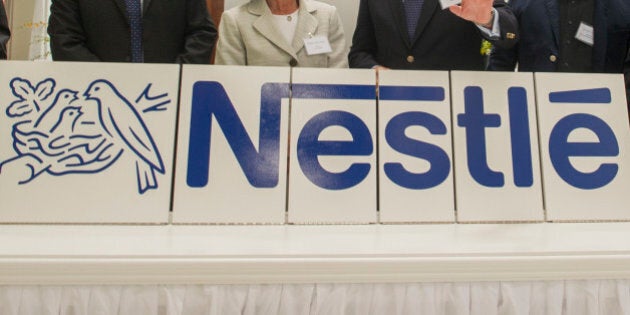 IMAGE DISTRIBUTED FOR NESTLà USA - From left, Andrew Reeves, Nestlé R&D chief engineer, Nestec Head of Global Product & Technology Development Johannes Baensch, Solon Mayor Susan Drucker, Nestlé USA Chairman and CEO Paul Grimwood, architect David Linford and Nestlé R&D Solon Director Sean Westcott attend the grand opening of a new Nestlé research and development center in Solon, Ohio, Wednesday, July 22, 2015. The facility is one of 12