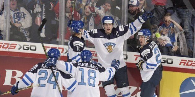 Mikko Rantanen of Finland (middle) celebrates with teammates after scoring the 3-2 during the 2016 IIHF World Junior Ice Hockey Championship final match Finland vs Russia in Helsinki, Finland, on January 5, 2016. / AFP / Lehtikuva / Markku Ulander / RESTRICTED TO EDITORIAL USE (Photo credit should read MARKKU ULANDER/AFP/Getty Images)