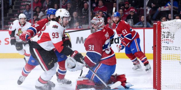 MONTREAL, QC - APRIL 24: The puck gets past Carey Price #31 of the Montreal Canadiens on a shot by Bobby Ryan #6 of the Ottawa Senators (not pictured) during Game Five of the Eastern Conference Quarterfinals of the 2015 NHL Stanley Cup Playoffs at the Bell Centre on April 24, 2015 in Montreal, Quebec, Canada. (Photo by Richard Wolowicz/Getty Images)