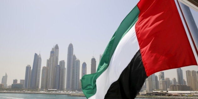 UAE flag flies over a boat at Dubai Marina, Dubai, United Arab Emirates May 22, 2015. REUTERS/Ahmed Jadallah