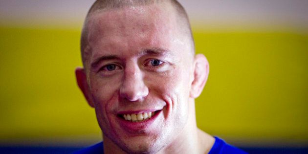 UFC (Ultimate Fighting Championship) Welterweight Champion Georges St-Pierre of Canada smiles during a training session on November 7, 2011 in Issy-les-Moulineaux, a neighboring suburb of Paris. AFP PHOTO JOEL SAGET (Photo credit should read JOEL SAGET/AFP/Getty Images)
