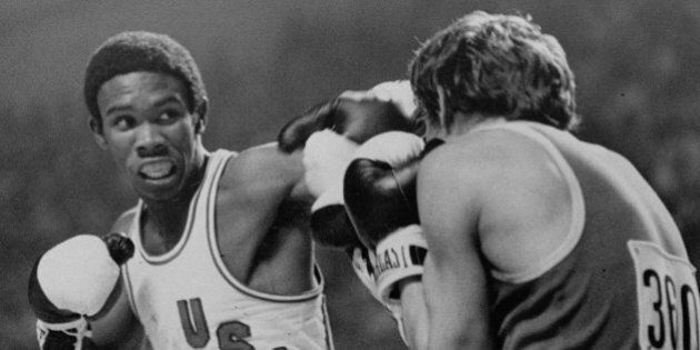 U.S.A. boxer Howard Davis slugs it out with Yugoslavian Ace Rusevski in lightweight boxing action at the Montreal Olympics Thursday, July 29, 1976. Davis was the winner. (AP Photo/pool)